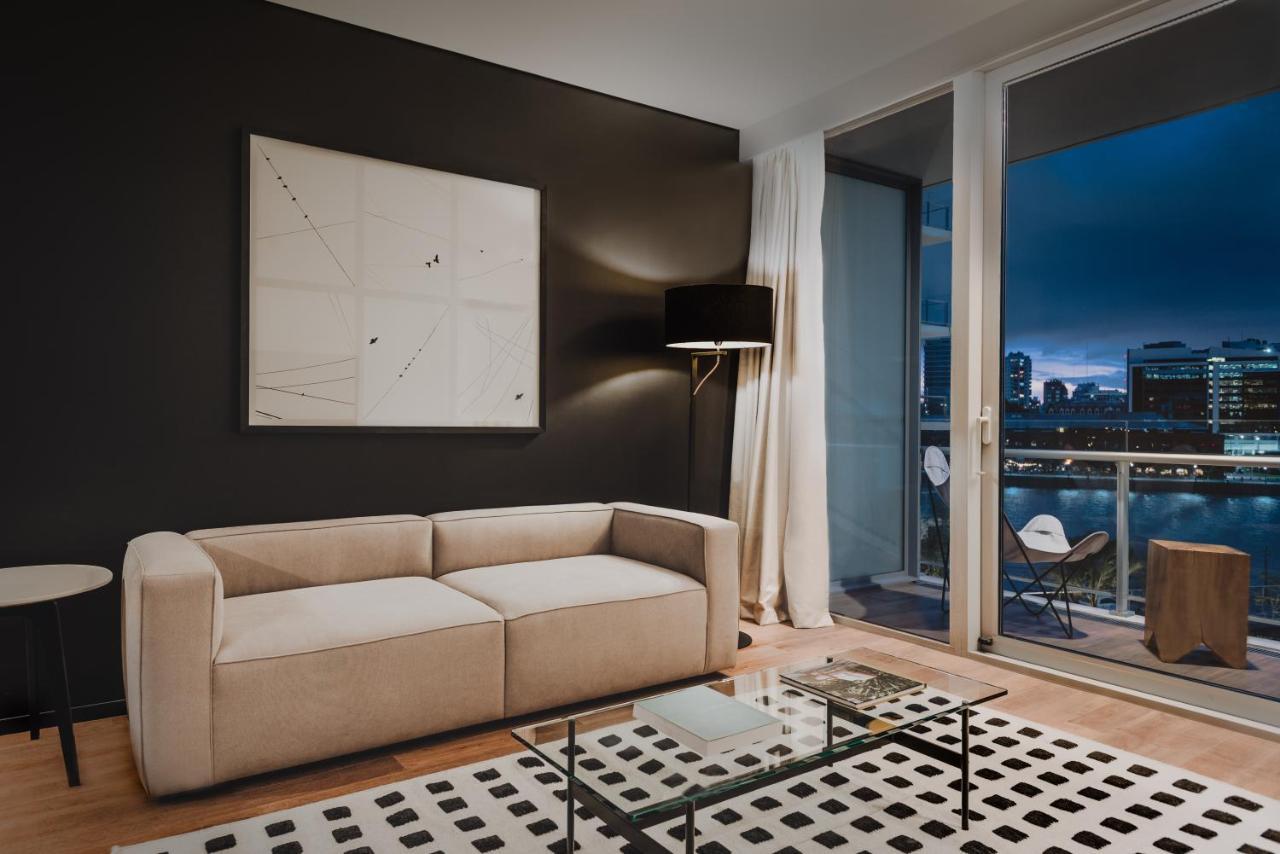 Sls Buenos Aires Puerto Madero Exterior foto A living room in a typical apartment