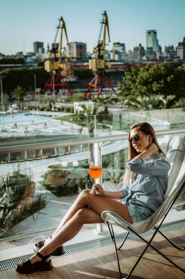 Sls Buenos Aires Puerto Madero Exterior foto A woman drinking an Aperol Spritz